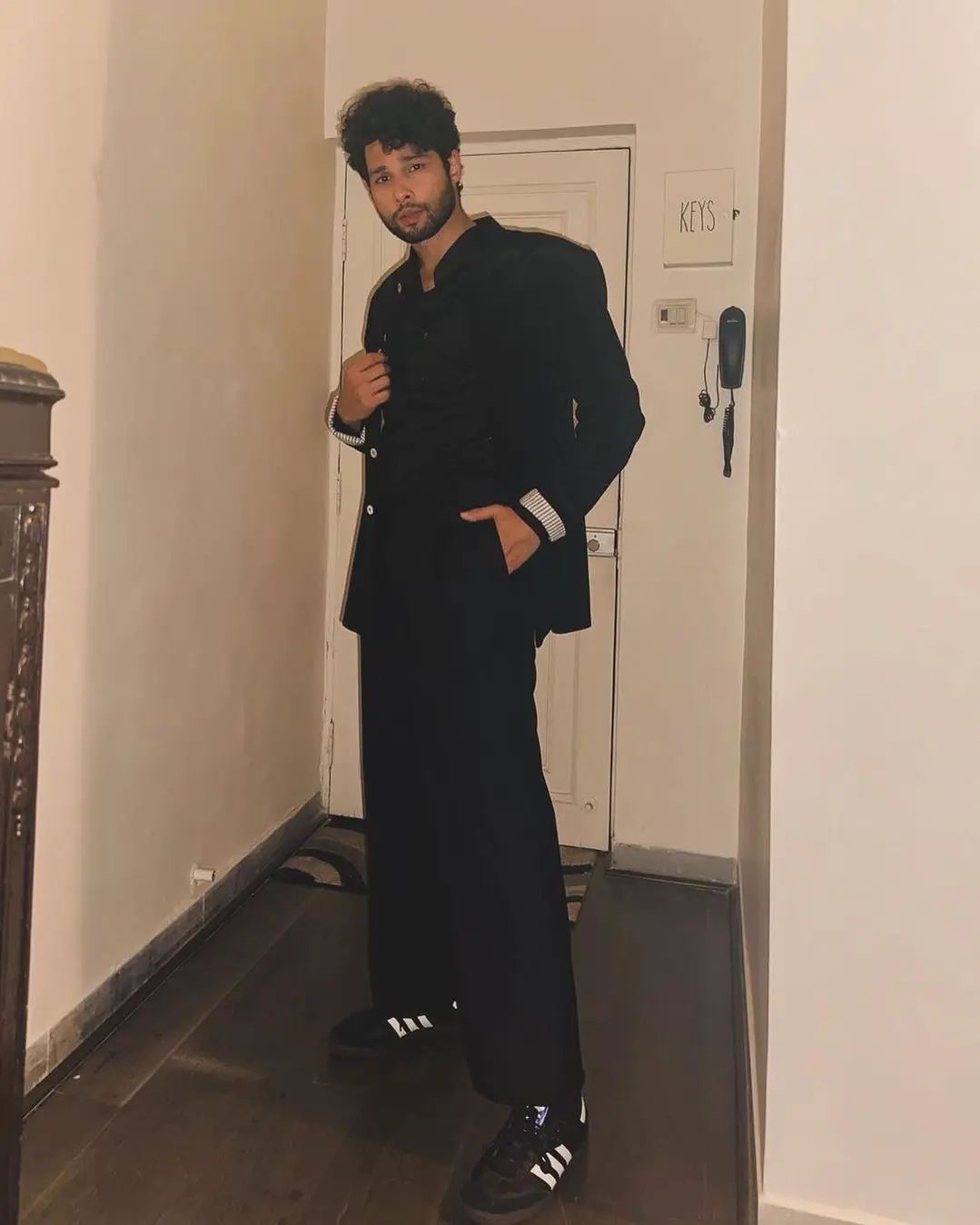 iddhant Chaturvedi, an Indian actor, smiling warmly in a casual outfit.